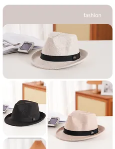 Detail of wool fedora hats featuring grosgrain ribbon and metallic logo emblems