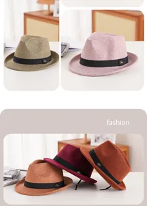Detail of wool felt fedora hats with grosgrain ribbon and metal bee pin in various colors