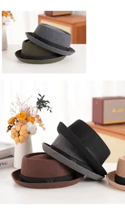 Stack of colorful vintage wool felt bowler hats with metal logo ribbon detail