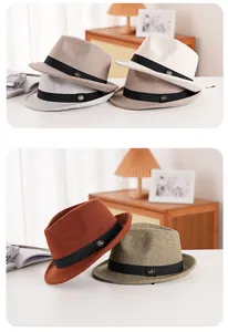 Selection of colorful wool felt fedora hats with decorative black ribbons and metal logos