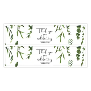 Detail of forest style wedding water bottle labels with green leaves and thank you text