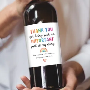 Hand holding wine bottle with humorous Teacher's Day thank you labels and rainbow motifs