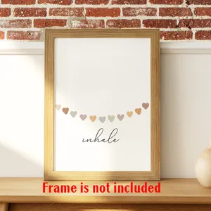 Detailed close-up of Inhale mental health poster with colorful hearts on brick wall
