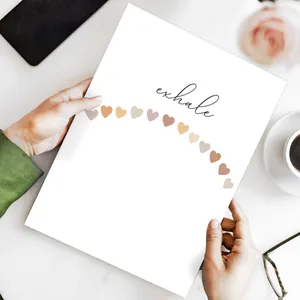Detail of minimalist 'exhale' poster featuring soft heart shapes and hand-drawn typography