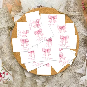 Detail showing elegant cards with pink watercolor bow and handwritten Thank You text