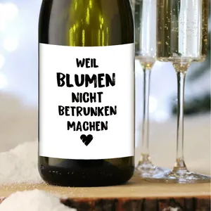 Detail of creative German wine bottle label featuring humorous text on a green glass bottle