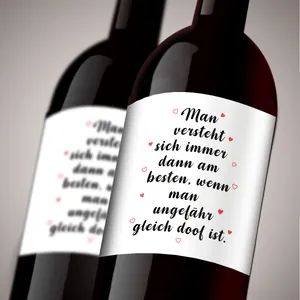 Close-up of German bottle label with humorous quote and red hearts for party decor