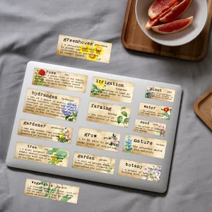 Set of vintage floral botanical definition stickers on grey fabric and wooden tray