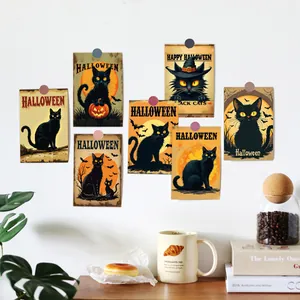 Retro Halloween black cat posters and pumpkin cards displayed on a white wall