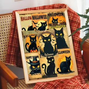 Vintage Halloween black cat postcards arranged in frames on a woven chair with a blanket