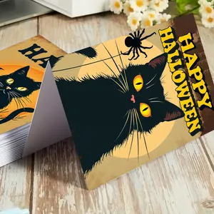 Set of 12 Halloween greeting cards with black cat and spider web on a wooden table
