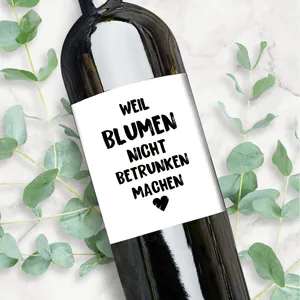 German wine bottle labels set with elegant heart design and festive text on dark glass