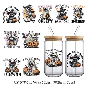 Detail of Halloween UV DTF cup wraps featuring cute raccoons and spooky cartoon patterns
