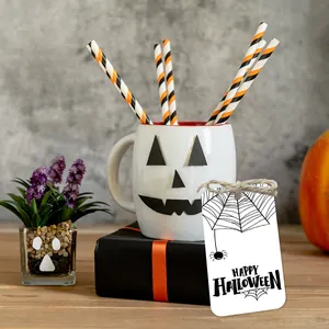 Halloween gift set with white pumpkin mug, striped straws and decorative paper labels