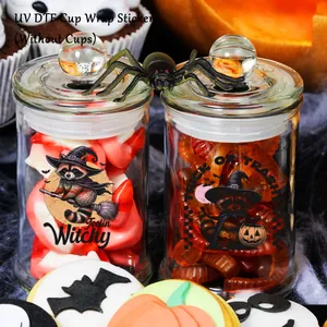 Detail of Halloween UV DTF cup wrap stickers with raccoon designs on glass jars