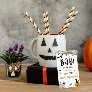 Detail of Halloween paper gift tags with twine, featuring pumpkins and spooky patterns