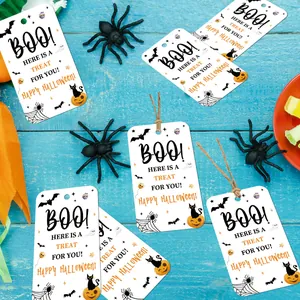 Detailed Halloween paper gift tags with festive patterns on a rustic blue wood background