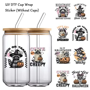 Halloween UV DTF cup wrap stickers featuring cute raccoons and pumpkins on glass