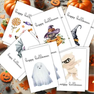 Detail of Halloween cards with ghost, pumpkin, and bat illustrations on a wooden surface