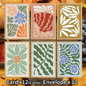 Flat lay of 12 floral thank you cards and envelopes with abstract botanical illustrations