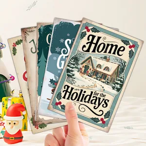 Close-up of vintage Christmas cards with festive Santa and winter scenery illustrations