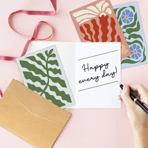 Detail of floral abstract thank you cards with kraft envelopes and handwritten note
