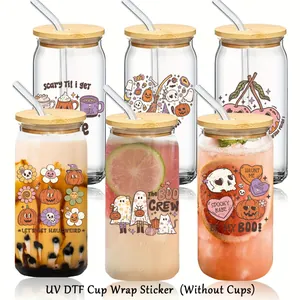Detail showing vintage Halloween UV DTF stickers applied to various 16oz glass cans