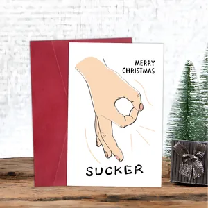 Funny Christmas card with Merry Christmas Sucker text on a rustic wooden table