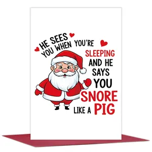 Detailed view of a Christmas card featuring Santa Claus and humorous holiday message
