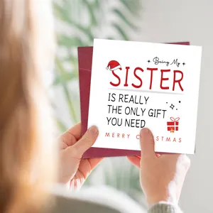 Funny Christmas card with red envelope featuring humorous text for sisters