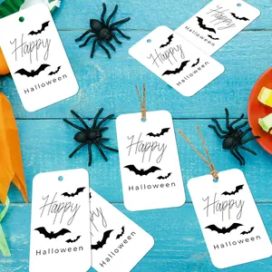 Halloween gift tags with Happy Halloween text and bat silhouettes on blue background