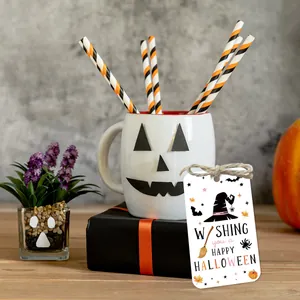 Detail of Halloween gift tags featuring pumpkins and witch hats on decorated gift boxes