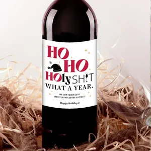 Detailed view of waterproof Christmas wine bottle stickers with festive typography and graphics
