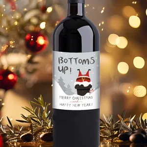 Close-up of waterproof Christmas wine labels with Santa Claus design on red wine bottles