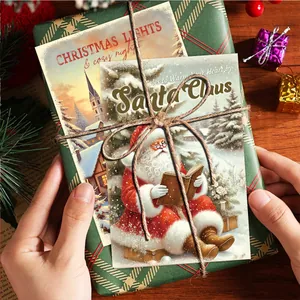 Close-up of vintage Christmas postcards on a green gift box with rustic holiday decor