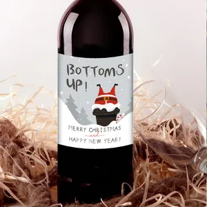 Detail of Christmas wine bottle sticker with cartoon Santa Claus stuck in chimney