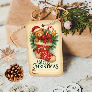 Detail of Christmas gift tag with teddy bear in stocking and Merry Christmas text