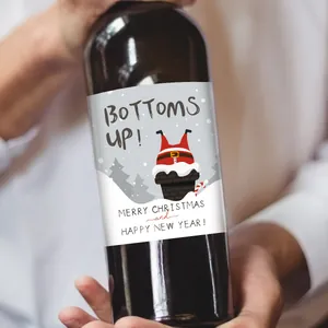 Detail of waterproof Christmas wine bottle sticker with Santa Claus in a chimney design