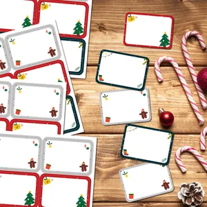 Detail of Christmas gift label stickers with festive patterns on a wooden background