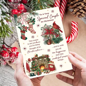 Close-up of hand-held vintage Christmas card with hand-drawn fireplace and stocking design