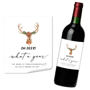 Detail eines Weihnachts-Weinetiketts mit Aquarell-Hirsch und festlichem Spruch