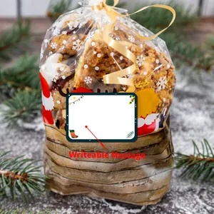 Detail of Christmas gift bag showing writeable message tag and festive snowflake patterns