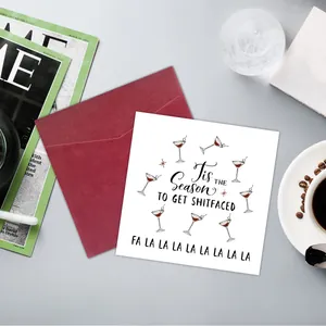 Funny Christmas card with cocktail illustrations and a red envelope in a cozy setting