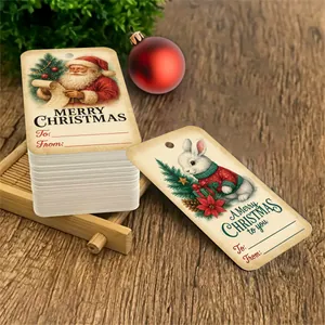 Detail of vintage Christmas gift tags with Santa and rabbit illustrations on cardstock