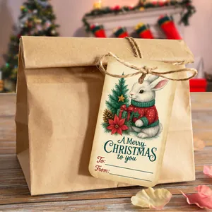 Detail showing vintage kraft Christmas gift tags with cute rabbit illustrations and twine