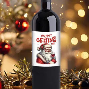 Macro view of Christmas wine bottle sticker with Santa Claus and festive bokeh background