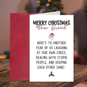 Funny Christmas greeting card with red envelope on a cozy festive wooden background