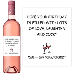 Detail of funny birthday wine label with drink graphic on pink sparkling wine bottle