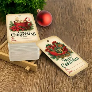 Close-up of vintage kraft paper Christmas gift tags featuring festive mug and sled illustrations