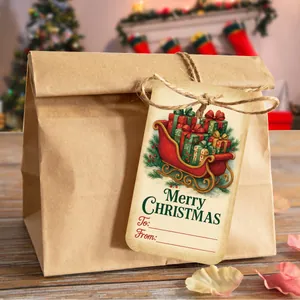 Macro view of Christmas gift tags with Santa sleigh design and twine on kraft bag